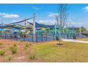 Community playground area features colorful play structures, shade coverings, and well maintained grounds at 4928 Durant Ave, North Charleston, SC 29405