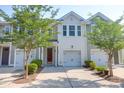 Inviting home exterior featuring tidy landscaping, a single-car garage, and light colored siding at 4964 Hay Bale Ct, Summerville, SC 29485