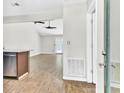 Open concept space featuring wood floors, neutral walls, and outdoor access at 703 Temple Rd # A, Ladson, SC 29456