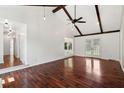 Large living room boasting beautiful hardwood floors, ceiling fan and French doors at 747 Brant Rd, Charleston, SC 29414
