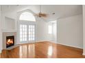 Open-concept living room with vaulted ceilings, fireplace, and abundant natural light at 8800 Dorchester Rd # 2004, North Charleston, SC 29420