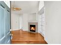 Bright, spacious living room features hardwood floors, a fireplace, and French doors at 8800 Dorchester Rd # 2004, North Charleston, SC 29420