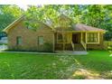 Attractive home with brick accents, siding, front lawn, and mature trees at 107 Joes Ln, Summerville, SC 29486