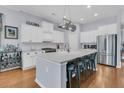 Spacious kitchen with white cabinets, a large island, and stainless steel appliances at 112 Riviera Dr, Summerville, SC 29483