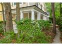 Inviting covered porch features classic white columns and lattice details at 114 Grand Palm Ln, Summerville, SC 29485
