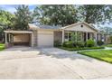 View of home featuring a convenient carport and garage at 131 Wedgewood Cir, Goose Creek, SC 29445