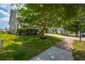 Lovely home featuring a green lawn, sidewalk and mature landscaping at 135 Gaslight Blvd, Summerville, SC 29483
