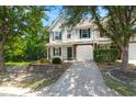 Charming two-story townhome featuring a well-manicured front yard and an attached one-car garage at 190 Darcy Ave, Goose Creek, SC 29445