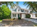 Charming two-story townhome featuring a well-manicured front yard and an attached one-car garage at 190 Darcy Ave, Goose Creek, SC 29445