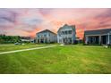 Picture-perfect home with a double porch and lush green lawn at 203 Symphony Ave, Summerville, SC 29486
