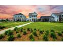 Beautiful new construction home with landscaped front yard and spacious lawn at 203 Symphony Ave, Summerville, SC 29486