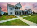 Attractive two-story home with inviting front porch and well-maintained lawn at 203 Symphony Ave, Summerville, SC 29486