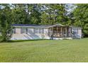 Charming single-story home with a covered front porch and well-kept lawn at 250 W Medina St, Summerville, SC 29483