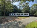 Charming single story home with a welcoming front porch and well maintained landscape at 260 Lake Dr, Summerville, SC 29483