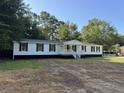 Inviting single story home with a covered front porch and classic shutters at 260 Lake Dr, Summerville, SC 29483