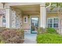 Home featuring a welcoming front porch with meticulously maintained landscaping at 271 Village Stone Cir, Summerville, SC 29486
