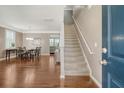 Open foyer with hardwood floors, a staircase, and views into the dining and living areas at 314 Sanctuary Park Dr, Summerville, SC 29486