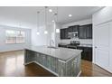 Open kitchen featuring a large center island, granite countertops, pendant lighting, and stainless steel appliances at 316 Knawl Rd, Moncks Corner, SC 29461