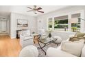 Bright and airy living room with neutral decor, hardwood floors, and large windows offering natural light at 327 Mcclain St, Charleston, SC 29407