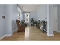 Inviting room featuring light blue walls, hardwood floors, plants and wicker chairs at 3525 E Higgins Dr, Mount Pleasant, SC 29466