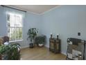 Inviting room featuring light blue walls, hardwood floors and natural light at 3525 E Higgins Dr, Mount Pleasant, SC 29466