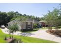 Beautiful home with a spacious driveway, manicured lawn, and a mix of brick and siding at 3751 St Ellens Dr, Mount Pleasant, SC 29466
