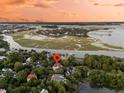 Waterfront neighborhood with winding rivers and stunning homes nestled among lush trees at 401 Ralston Creek St, Charleston, SC 29492