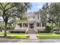 Beautiful two-story home featuring a grand entrance with brick steps and a well-manicured lawn at 401 Ralston Creek St, Charleston, SC 29492