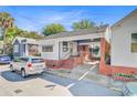 Charming single-story home featuring a brick and white facade with a convenient covered parking area at 6 Dewey St, Charleston, SC 29403