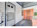 Inviting front porch with brick accents, featuring a screen door and classic wooden door at 6 Dewey St, Charleston, SC 29403