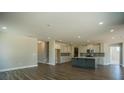 Spacious living room with hardwood floors and an open floor plan to the kitchen at 713 Breakers Reef Ln, Huger, SC 29450