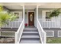 Inviting front porch with decorative details and well-maintained landscaping at 721 Lake Frances Dr, Charleston, SC 29412
