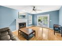 Comfortable living room with a fireplace, hardwood floors, and natural light at 721 Lake Frances Dr, Charleston, SC 29412