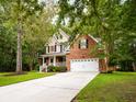 Lovely home with a spacious driveway and a well-kept yard, offering a welcoming curb appeal at 8316 Dye Makers, North Charleston, SC 29418
