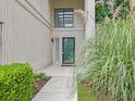 Inviting front entrance features a decorative green door, greenery, and a pathway to the home at 10 Stallion Ct, Charleston, SC 29407