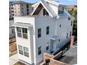 Stunning exterior showcasing sharp rooflines and modern window designs under a sunny sky at 101 Hanover St, Charleston, SC 29403