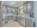 Updated kitchen with stainless steel appliances, granite countertops, and ample cabinet space at 106 Nottingham Ct, Summerville, SC 29485