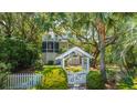Beautiful home with manicured landscaping, privacy fence, and mature trees at 11 49Th Ave, Isle of Palms, SC 29451