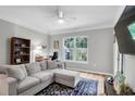 Comfortable living room features a large window and neutral decor at 1300 Park West Blvd # 512, Mount Pleasant, SC 29466