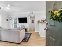 Inviting living room with neutral tones, wood floors, and a sliding door to the exterior at 1300 Park West Blvd # 512, Mount Pleasant, SC 29466