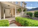 Charming front porch with decorative plants and brick-trimmed steps at house number 1308 at 1308 Wild Olive Dr, Mount Pleasant, SC 29464