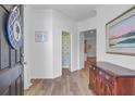 Welcoming entryway featuring hardwood floors, neutral paint, and tasteful decor, setting a warm tone at 142 Elliott Creek Ln, Summerville, SC 29485