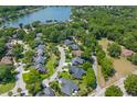 Aerial view of a residential neighborhood with mature trees and community lake at 1441 Waterside Ct, Mount Pleasant, SC 29464