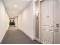 Hallway featuring a carpeted floor, a neutral color scheme, and a view to the end at 145 Pier View St # 111, Charleston, SC 29492