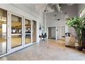 Spacious lobby with tile flooring and glass doors, offering a bright and modern entrance at 150 Bee St # 308, Charleston, SC 29401