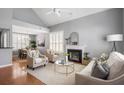 Bright and airy living room with hardwood floors, a fireplace, and comfortable seating for Gathering and friends at 2009 Arundel Pl, Mount Pleasant, SC 29464