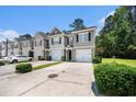 Beautiful townhomes with neat landscaping, individual garages, and inviting curb appeal at 234 S Lamplighter Ln, Summerville, SC 29486