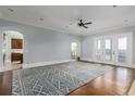 Open-concept living room with hardwood floors and French doors leading to the outdoor space at 2668 Crooked Stick Ln, Mount Pleasant, SC 29466