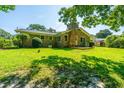 View of the back of the property featuring a spacious yard and brick exterior at 2847 Limestone Blvd, Charleston, SC 29414
