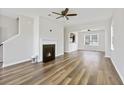 Bright living room features a decorative fireplace and hardwood floors, creating a warm and inviting space at 302 Mossy Wood Rd, Summerville, SC 29483
